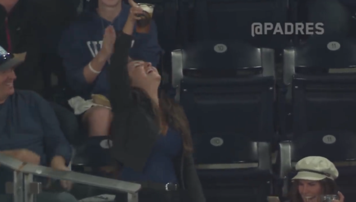 fan chugs beer at Padres game