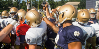 The Fighting Irish huddle during training camp practice.
